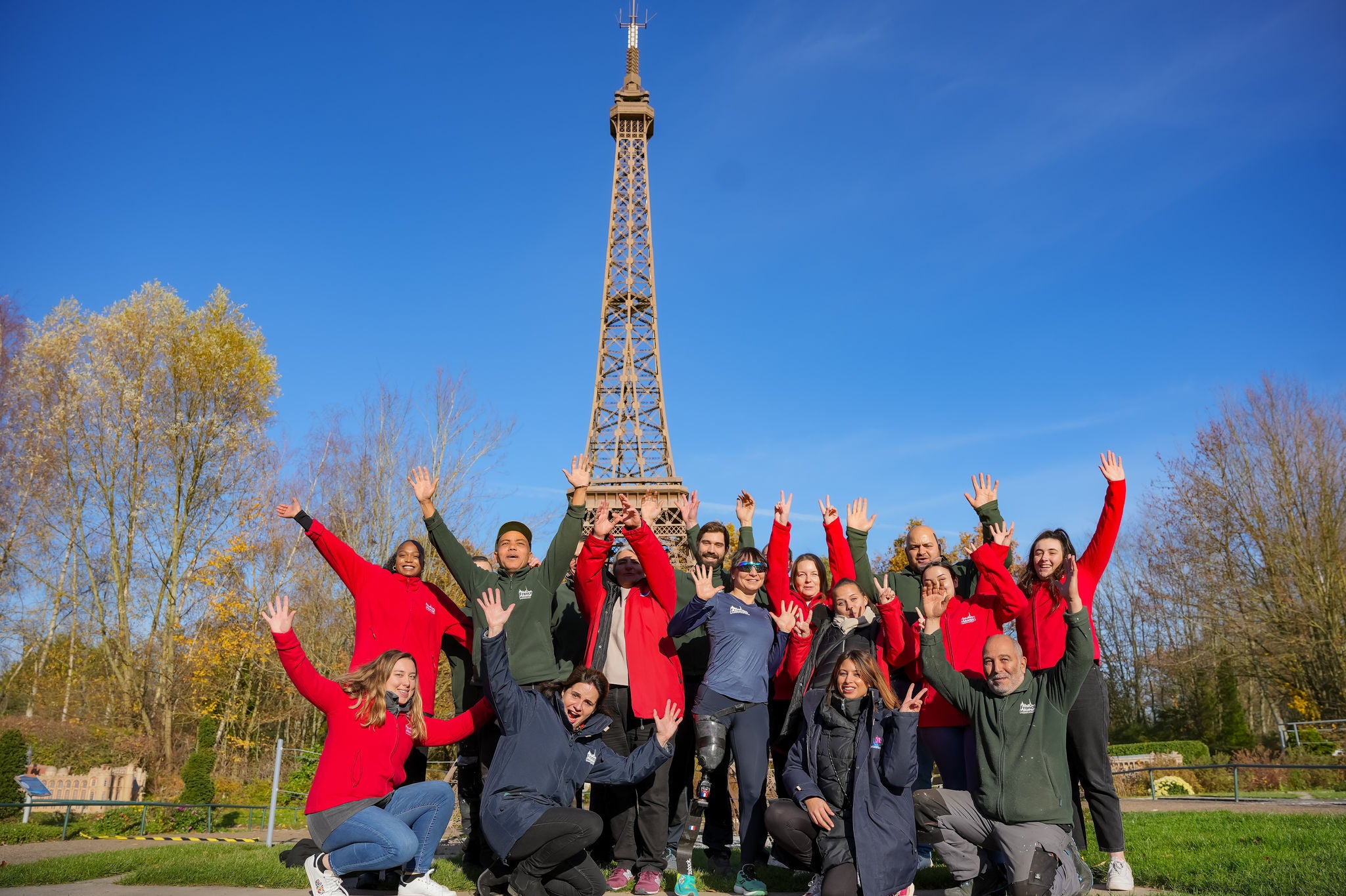 Photo of France Miniature team with Cécile Saboureau in front of miniature tour eiffel 