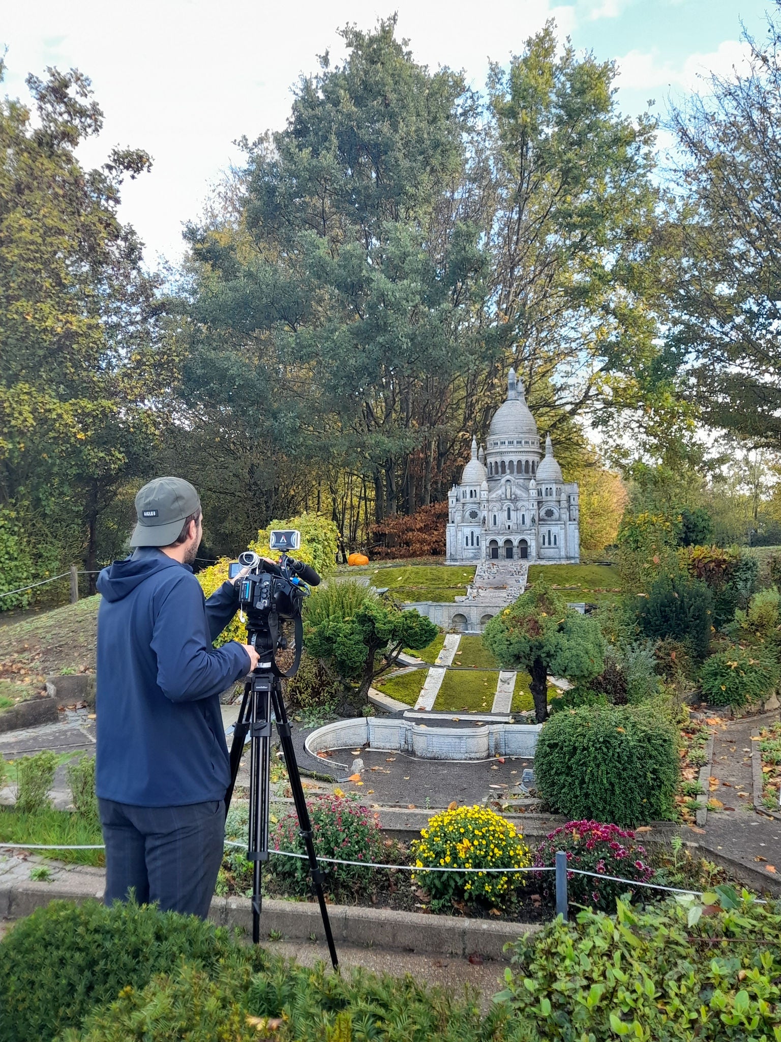 Press coverage in front of sacré coeur miniature at France Miniature